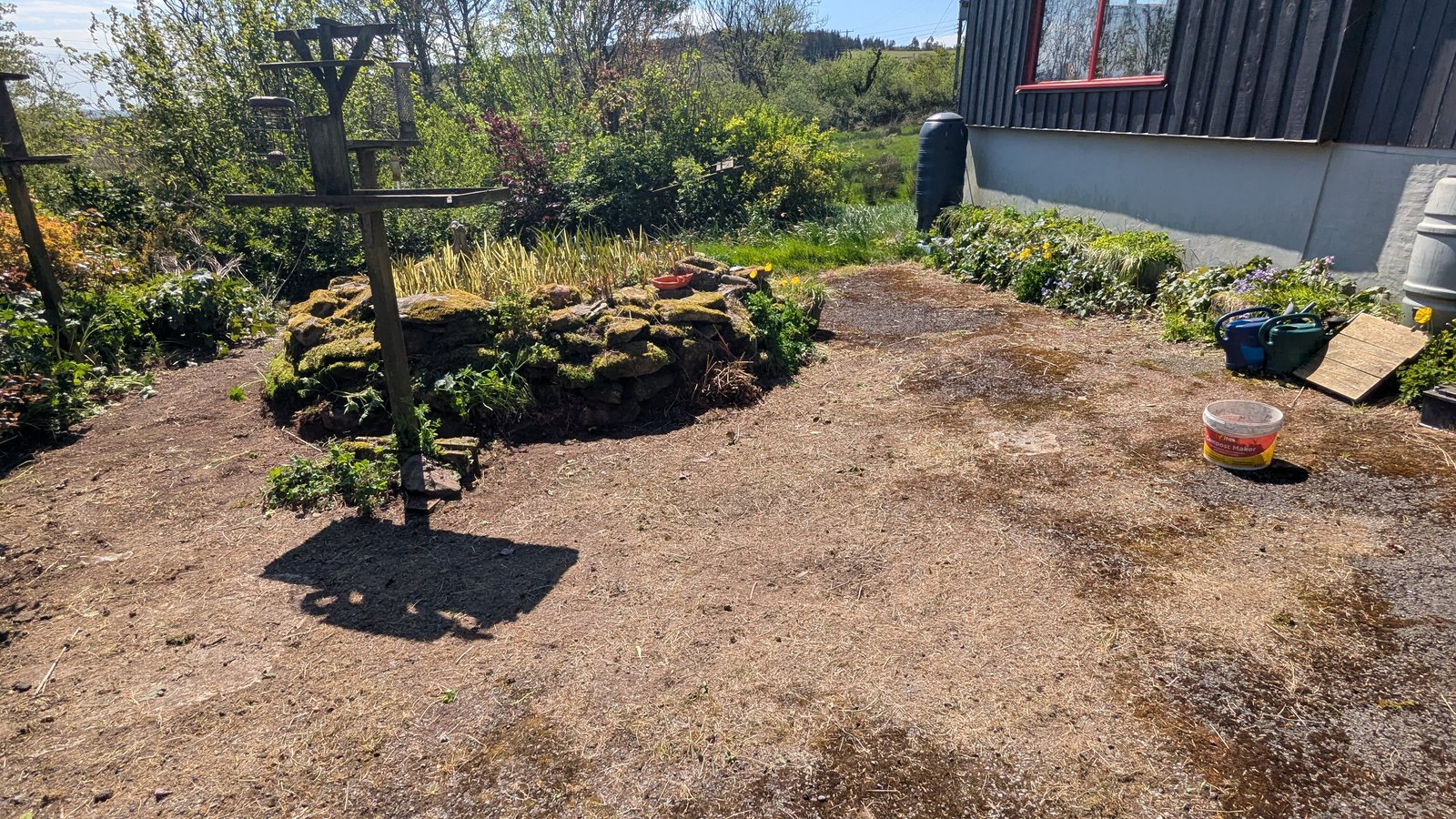 After: Neglected driveway and pond area, cleared and tidied